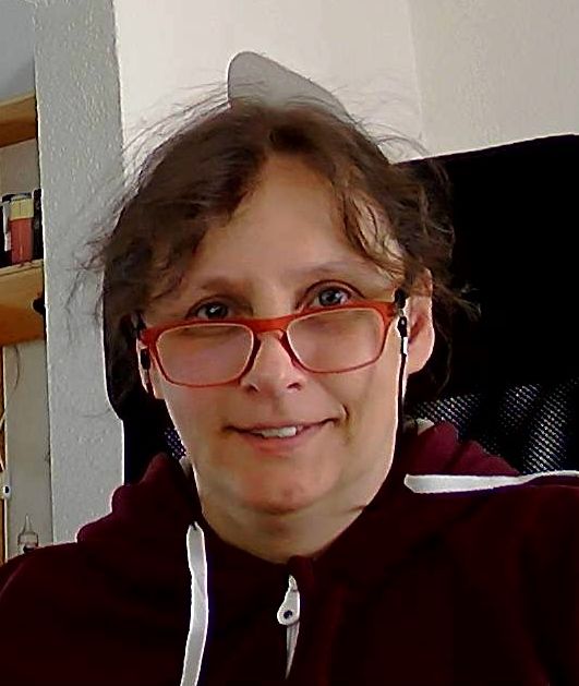 Picture of me wearing glasses and smiling at the camera